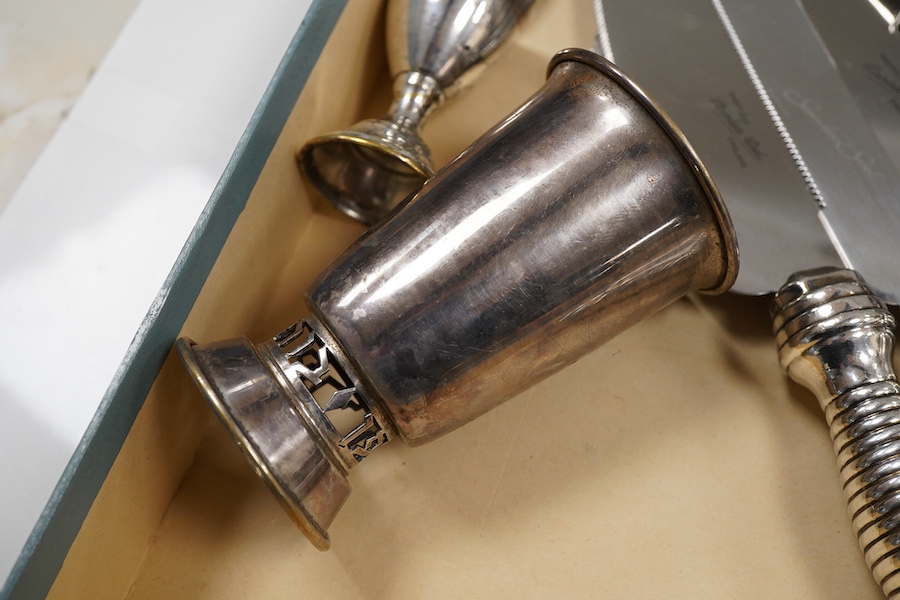 A pair of George V silver kiddush cups, maker M.S., London, 1919, 9cm, one other silver kiddush cup, two Judaic sterling tots, a set of eight Polish white metal tots, maker SJ, one other pair of Polish white metal tots,